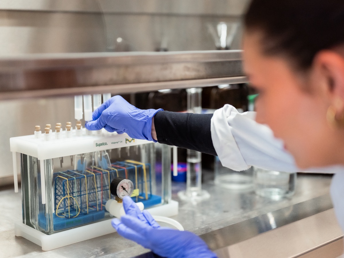 Sommerly Grimaldi-Ertl demonstrating how she uses solid phase extraction in the lab.